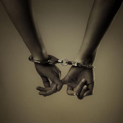 two girl hand and handcuffs